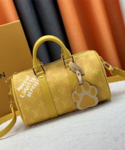 Louis Vuitton Monogram Heritage Canvas Keepall Bandouliere 25 In Yellow